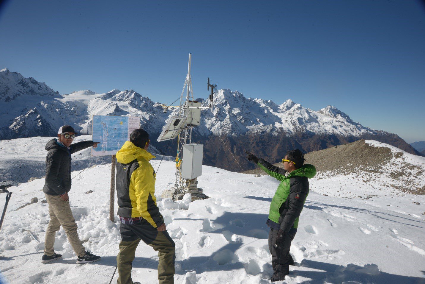 Expedition members pose for a photo after carrying out routine maintenance work on the automatic weather station on Yala Glacier, Langtang Valley