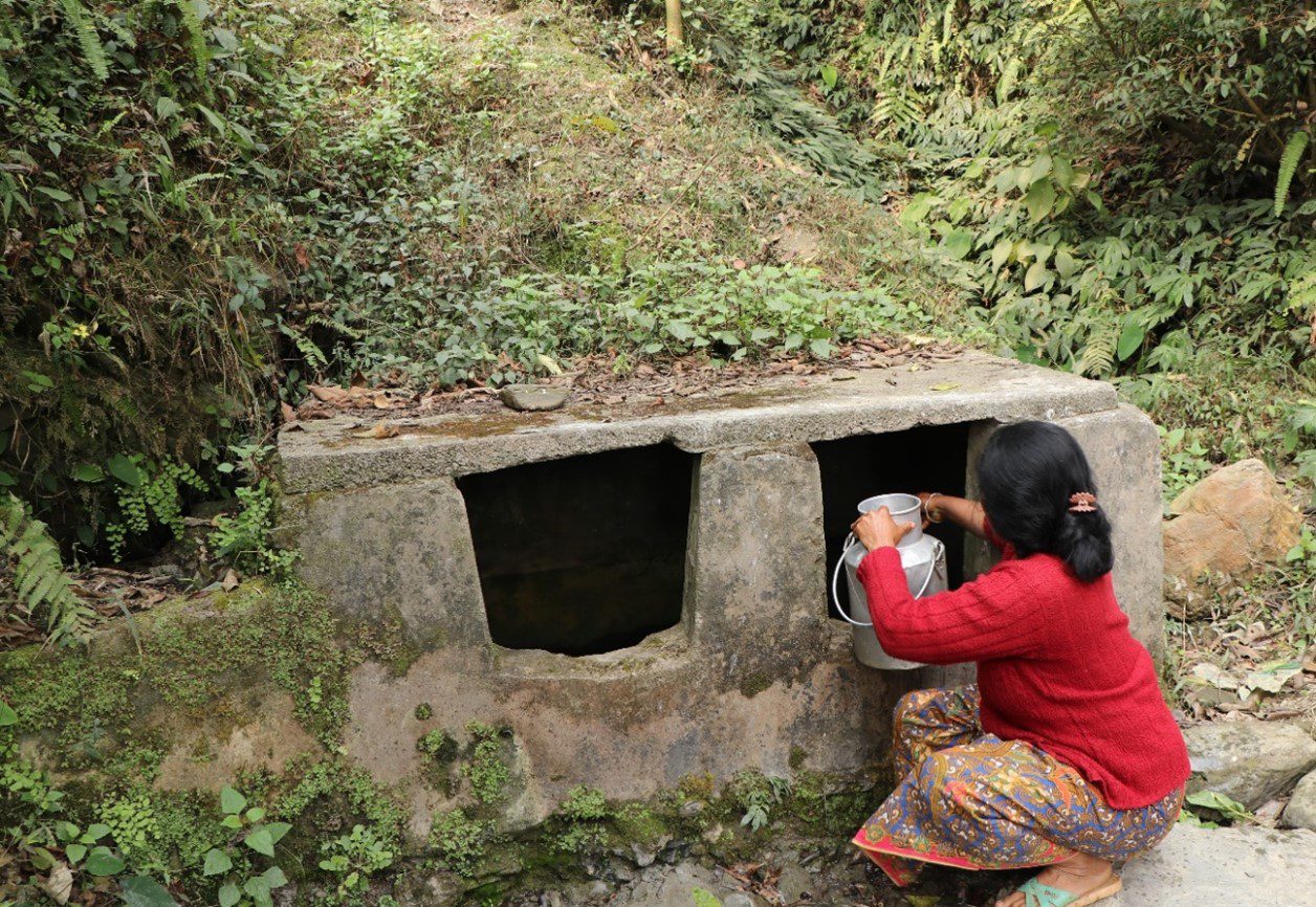 resident collecting water